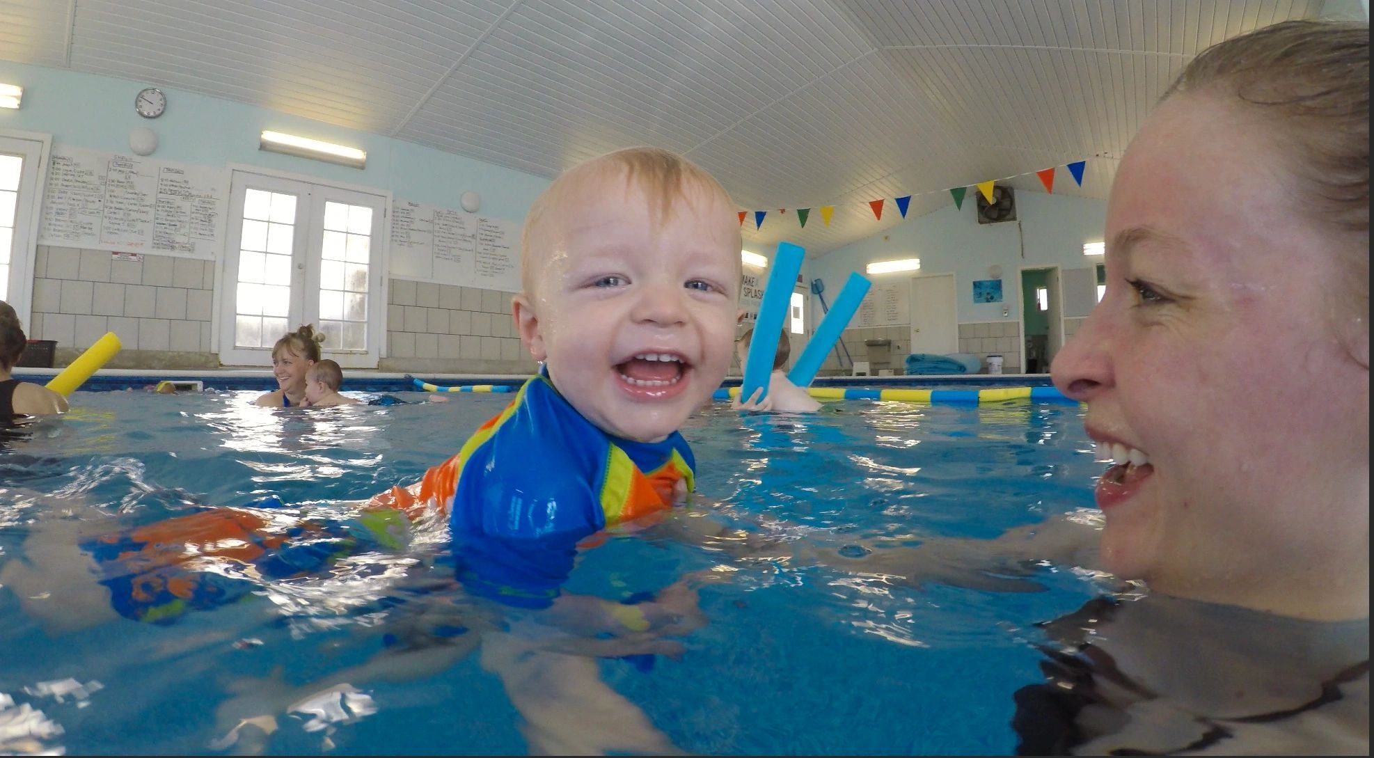 Toddler enjoying a swim lesson